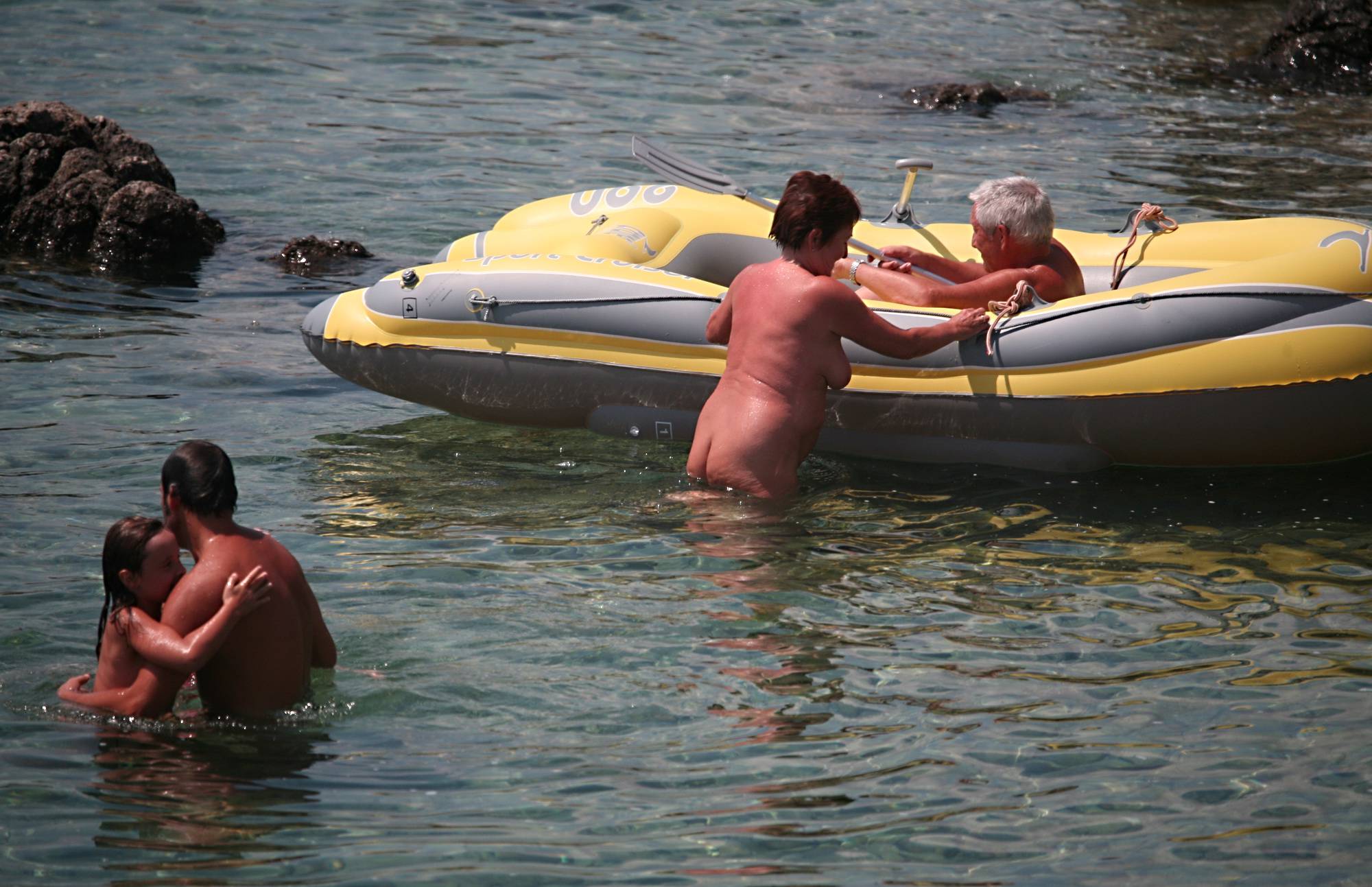 Lone Nudist in Yellow Boat - 1